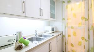 Kuchyňa alebo kuchynka v ubytovaní Residencial Azul Marino