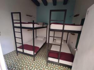 a room with two bunk beds in a room at Blue Bicycle House in Querétaro