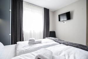 Łóżko lub łóżka w pokoju w obiekcie Luxury Apartment Nina with sea view
