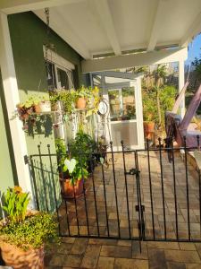 a porch with potted plants on a house at Löwensteiner Berge in Löwenstein