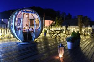 a large orb sitting on a deck at night at Luttrell Arms in Dunster