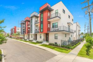 a row of apartment buildings on a street at 4BR Townhouse in Bienville Villas in New Orleans