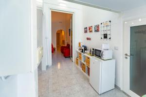 A kitchen or kitchenette at Antonella home b&b