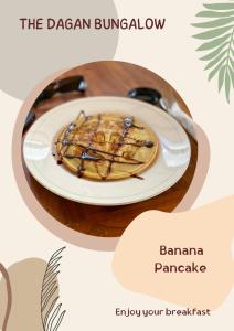 a plate of food on a table with a dessert at The Dagan Bungalow in Nusa Penida