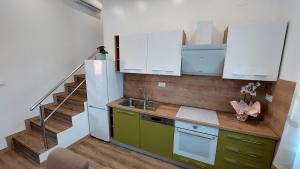 Kuchyňa alebo kuchynka v ubytovaní Apartments Arsen