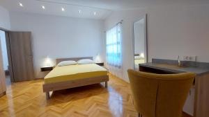 Posteľ alebo postele v izbe v ubytovaní Apartments Arsen