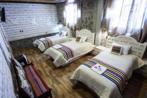 HOTEL CASONA DE SAL tesisinde bir odada yatak veya yataklar