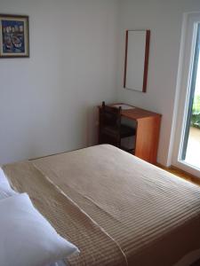 Postel nebo postele na pokoji v ubytování Apartments Đerek Pisak