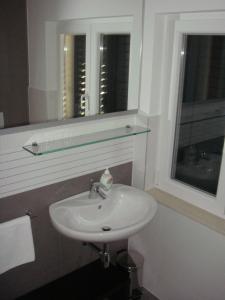 Koupelna v ubytování Apartments Đerek Pisak
