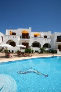 a swimming pool in front of a building at Summer Dream II in Agia Anna Naxos