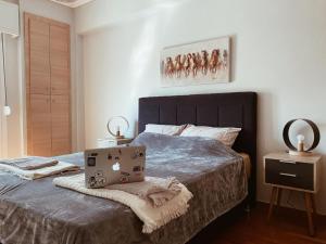a hotel room with a bed and a desk at Thanasis Place in Athens