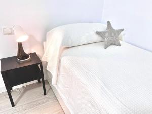 Posteľ alebo postele v izbe v ubytovaní Apartamento en Ametlla de Mar SEA VIEW HAUS FREE WIFI