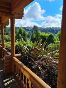 a view from the porch of a house at Countryside Log Cabin With Hot Tub - Beech in Leominster