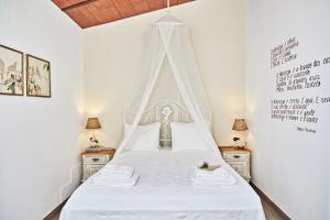 מיטה או מיטות בחדר ב-Casa Recanto da Horta - Casas com EnCanto