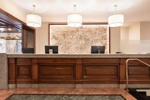 a lobby with a large wall with a map at Exe Alfonso VIII in Plasencia