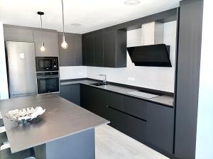 Kuchyňa alebo kuchynka v ubytovaní Apartamento en Ametlla de Mar SEA VIEW HAUS FREE WIFI