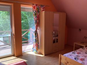 Postel nebo postele na pokoji v ubytování Szigliget Strand mellet levő, csendes, kényelmes ház