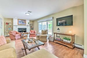 a living room with a fireplace and a tv at East Stroudsburg Home with Fire Pit and Private Pond in East Stroudsburg