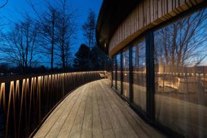 a wooden walkway next to a building with a fence at Ramside Hall Hotel, Golf & Spa in Durham