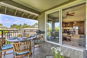 a patio with a table and chairs on a balcony at Sun-Soaked Waikoloa Retreat with Private Lanai! in Waikoloa