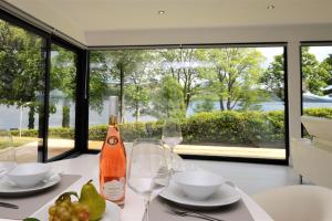 a table with glasses and a bottle of wine on it at The Lookout in Tighnabruaich