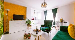 TV a/nebo společenská místnost v ubytování Apartman GREEN