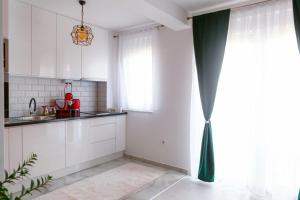 Kuchyň nebo kuchyňský kout v ubytování Apartman GREEN