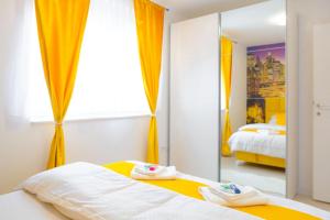 Postel nebo postele na pokoji v ubytování Apartman GREEN