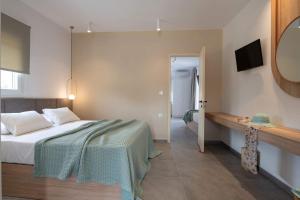 Postel nebo postele na pokoji v ubytování Asteras Hotel