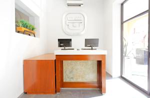 TV a/nebo společenská místnost v ubytování Hotel Olmeca Plaza