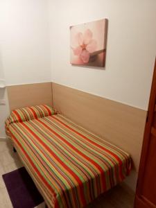 Posteľ alebo postele v izbe v ubytovaní ALOJAMIENTO PLAYA CHICA, LOS POZOS HABITACIONES