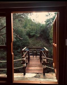 a view of a wooden walkway through a door at Bosco Paradiso in Limassol