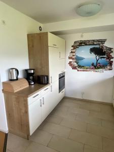 Kuchyň nebo kuchyňský kout v ubytování Ferienwohnung Hochriesblick