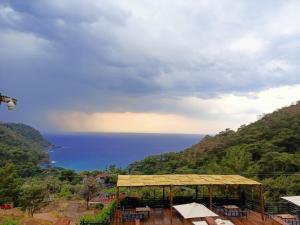 a gazebo with a view of the ocean at Tree Houses Hotel in Fethiye