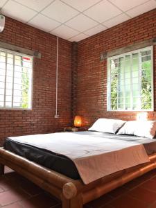 Postel nebo postele na pokoji v ubytování Nguyet Que Homestay & Tours