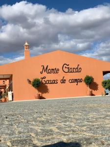 a building with a sign on the side of it at Herdade Monte Gordo in Ourique