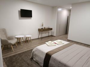 Uma cama ou camas num quarto em Olhares do Lobo