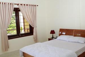 Postel nebo postele na pokoji v ubytování Nguyet Que Homestay & Tours