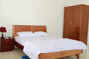 Postel nebo postele na pokoji v ubytování Nguyet Que Homestay & Tours
