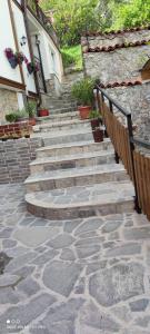 a set of stone stairs next to a building at Apartments Lapidarium in Ohrid