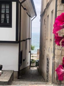 an alley with a view of the ocean from a building at Apartments Lapidarium in Ohrid