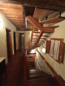 a hallway with wooden stairs in a house at Casa de Abril 2 in San Cristóbal de Valdueza +11 photos
