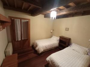 Säng eller sängar i ett rum på Casa de Abril 2