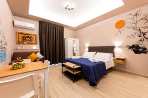 Posteľ alebo postele v izbe v ubytovaní ASTARE -short lets in bari carrassi-
