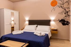Posteľ alebo postele v izbe v ubytovaní ASTARE -short lets in bari carrassi-