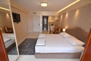 Postel nebo postele na pokoji v ubytování Apartments Daki