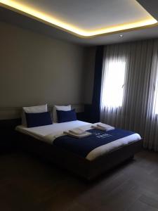 Krevet ili kreveti u jedinici u okviru objekta Kibar Suite Hotel