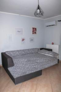 A bed or beds in a room at Agis home