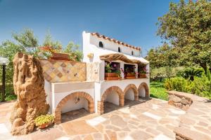 a model of a house with a patio at Sisula Country Hotel & SPA in Orosei