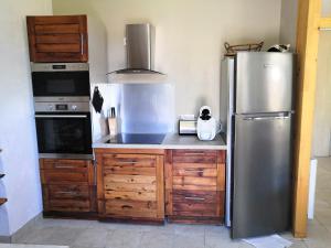 Kuchyňa alebo kuchynka v ubytovaní Appartement entier T4 à Jausiers